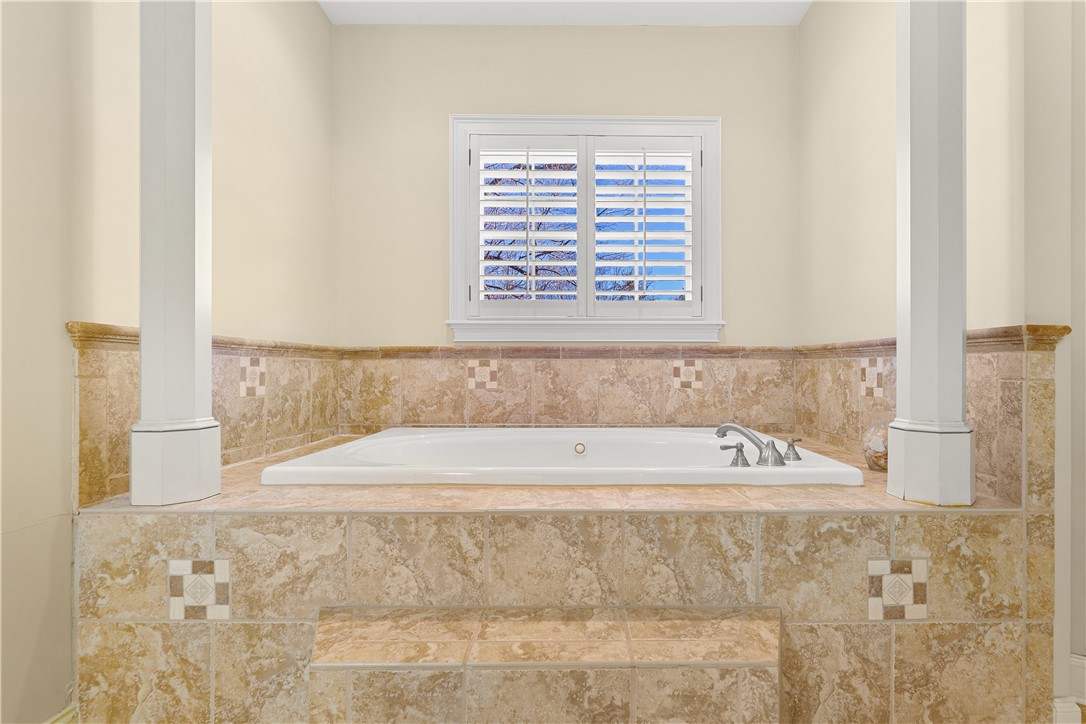 109 Limelight Drive Anderson, SC 29621 - Photo 13 of 34 Relax in this inviting bathroom featuring a deep soaking tub and elegant tile work.