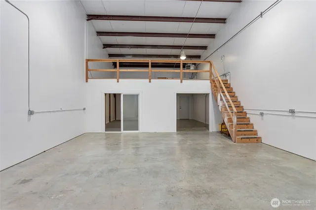 a view of an empty room with stairs