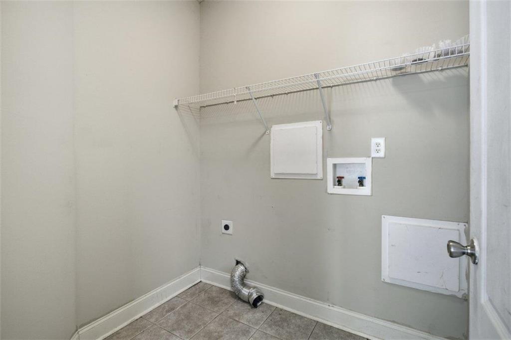 1231 Hillview Road Hampton, GA 30228 - Photo 11 of 49 a bathroom with a window and a shower