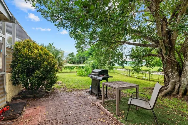 a view of backyard with green space