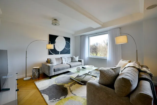 a living room with furniture and window