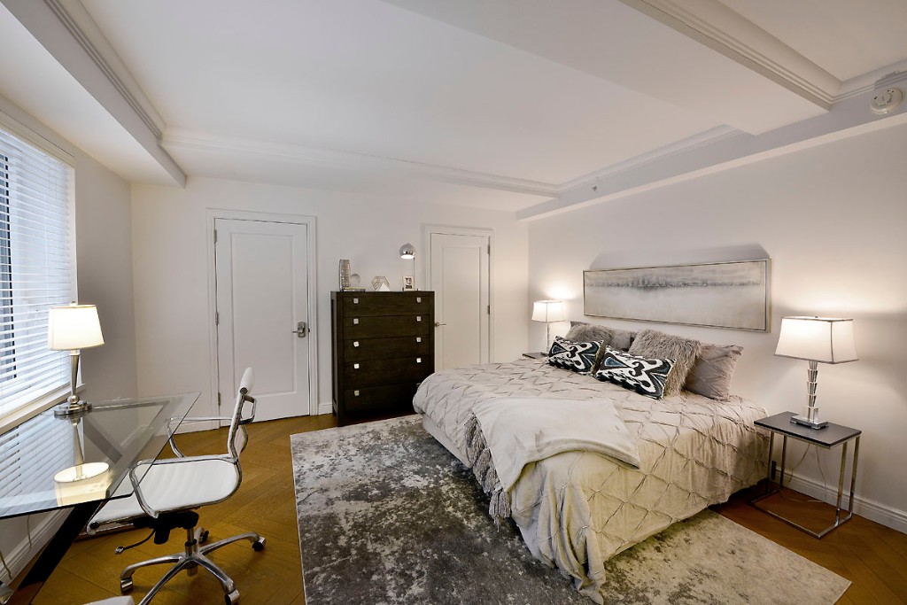 160 Central Park South, Unit 414 Manhattan, NY 10019 - Photo 7 of 12 a bedroom with a bed and a lamp