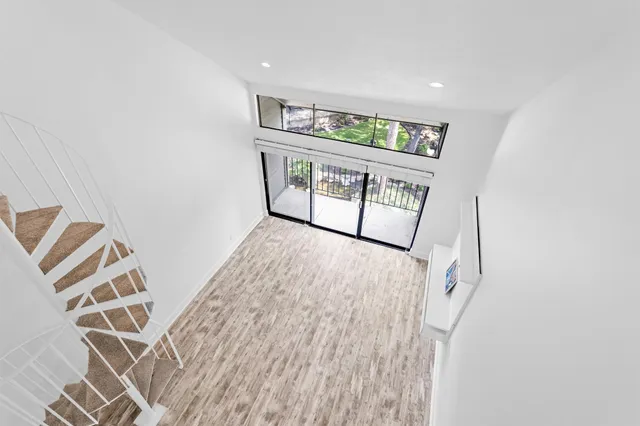 wooden floor with windows and closet