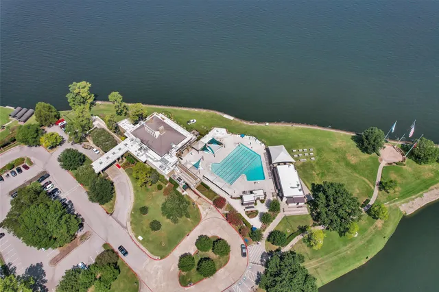 an aerial view of a house with a swimming pool