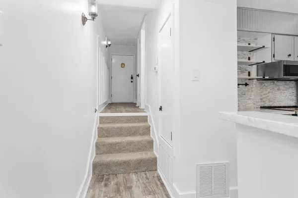 a view of staircase with white walls