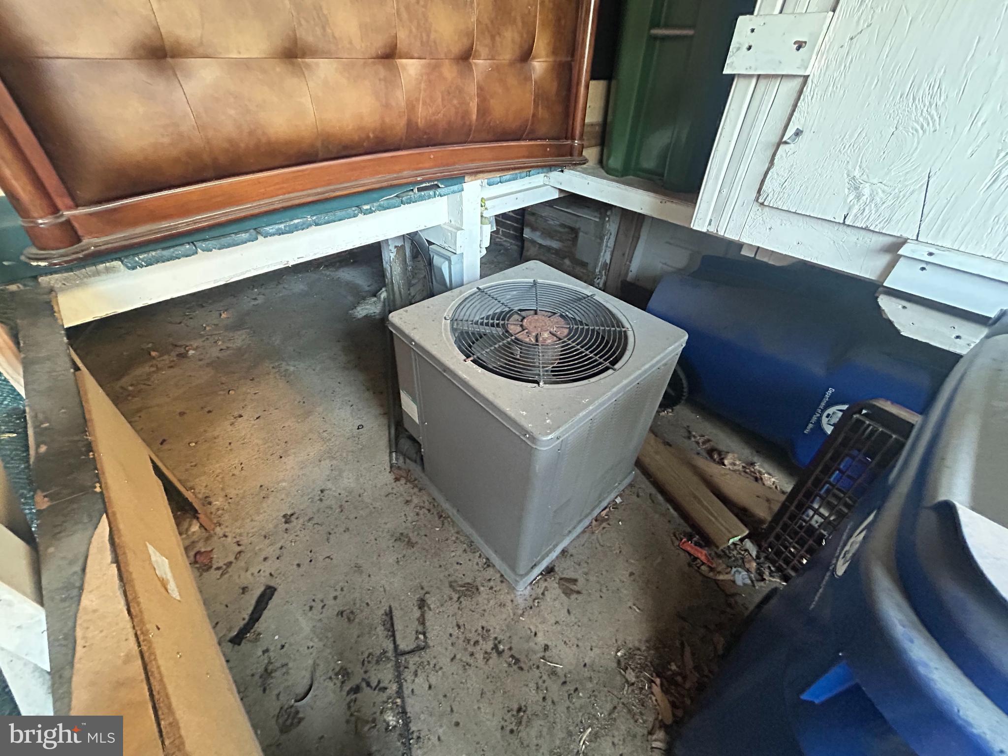 307 South Mount Street Baltimore, MD 21223 - Photo 13 of 17 a room with storage and utility