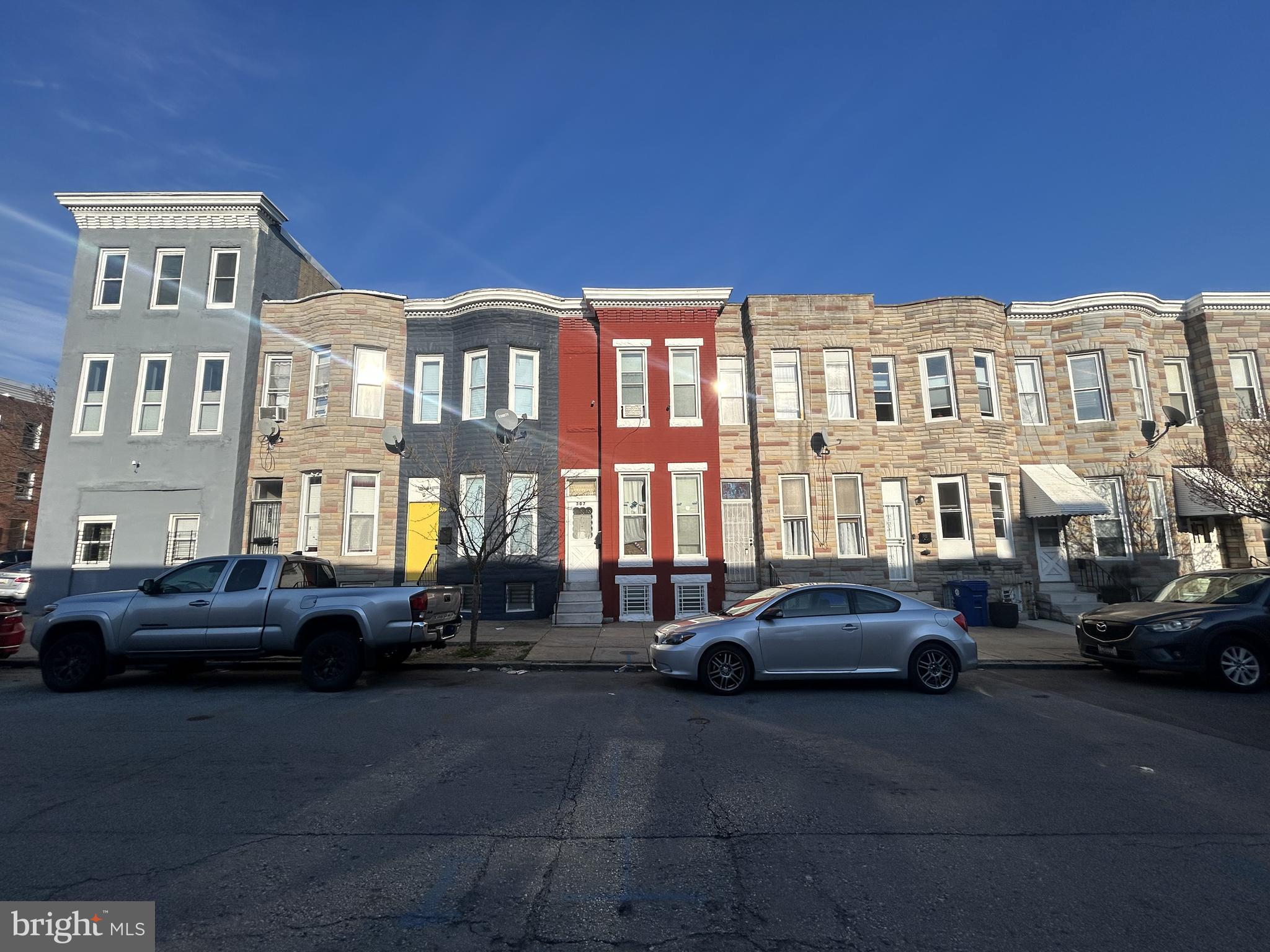 307 South Mount Street Baltimore, MD 21223 - Photo 2 of 17 a buildings with car parked in front of it