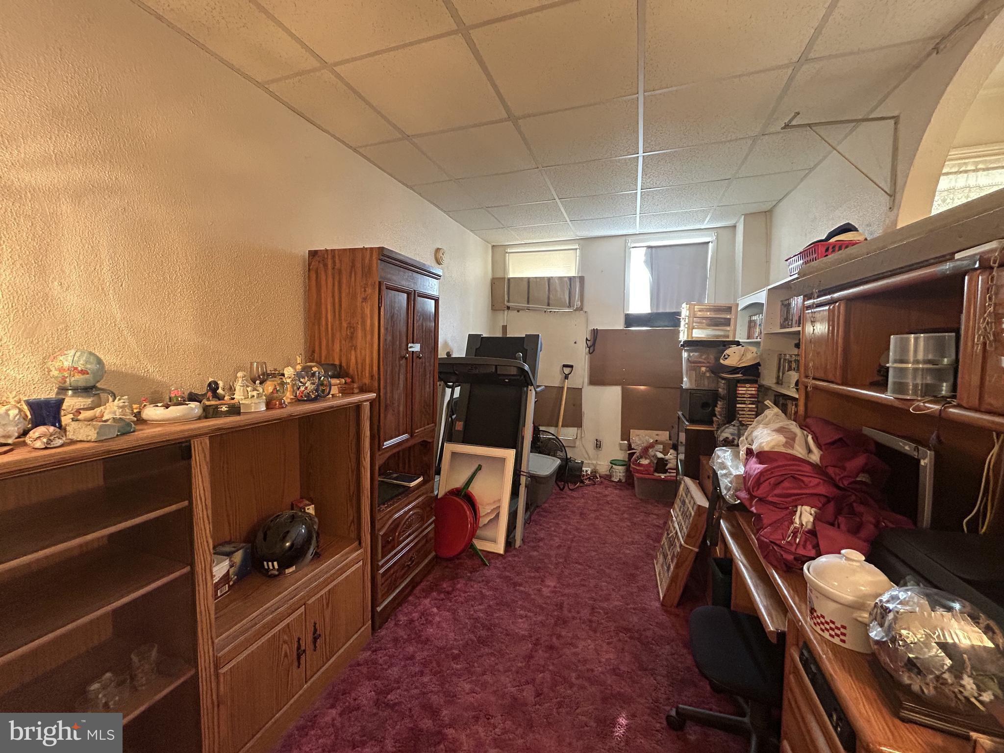 307 South Mount Street Baltimore, MD 21223 - Photo 5 of 17 a living room with furniture a flat screen tv and kitchen view