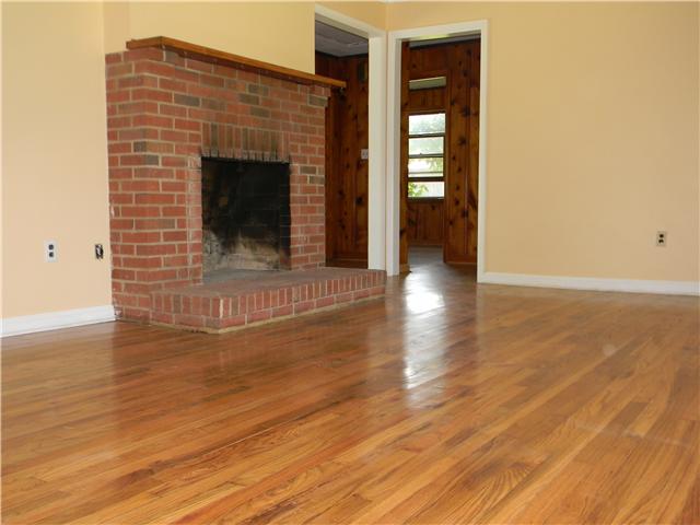 5049 Pickering Road Clarksville, TN 37043 - Photo 2 of 19 Wood burning fireplace, refinished hardwood floors.