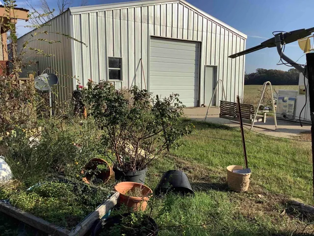 a view of a wooden deck and a yard