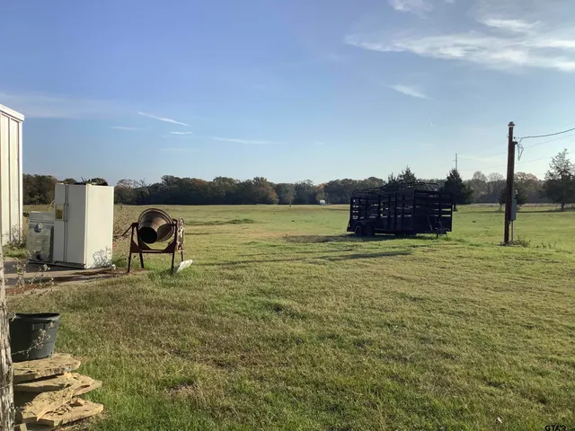 a view of a lake with a big yard