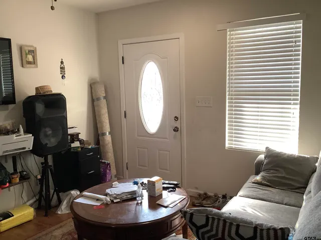 a room with furniture and wooden floor