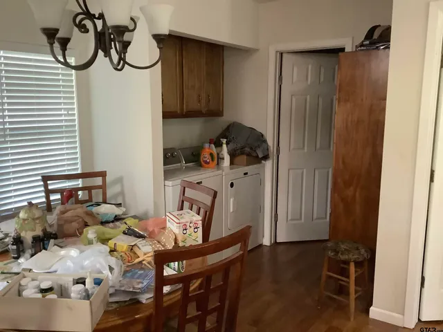 a kitchen with stainless steel appliances granite countertop a sink dishwasher and microwave with wooden cabinets