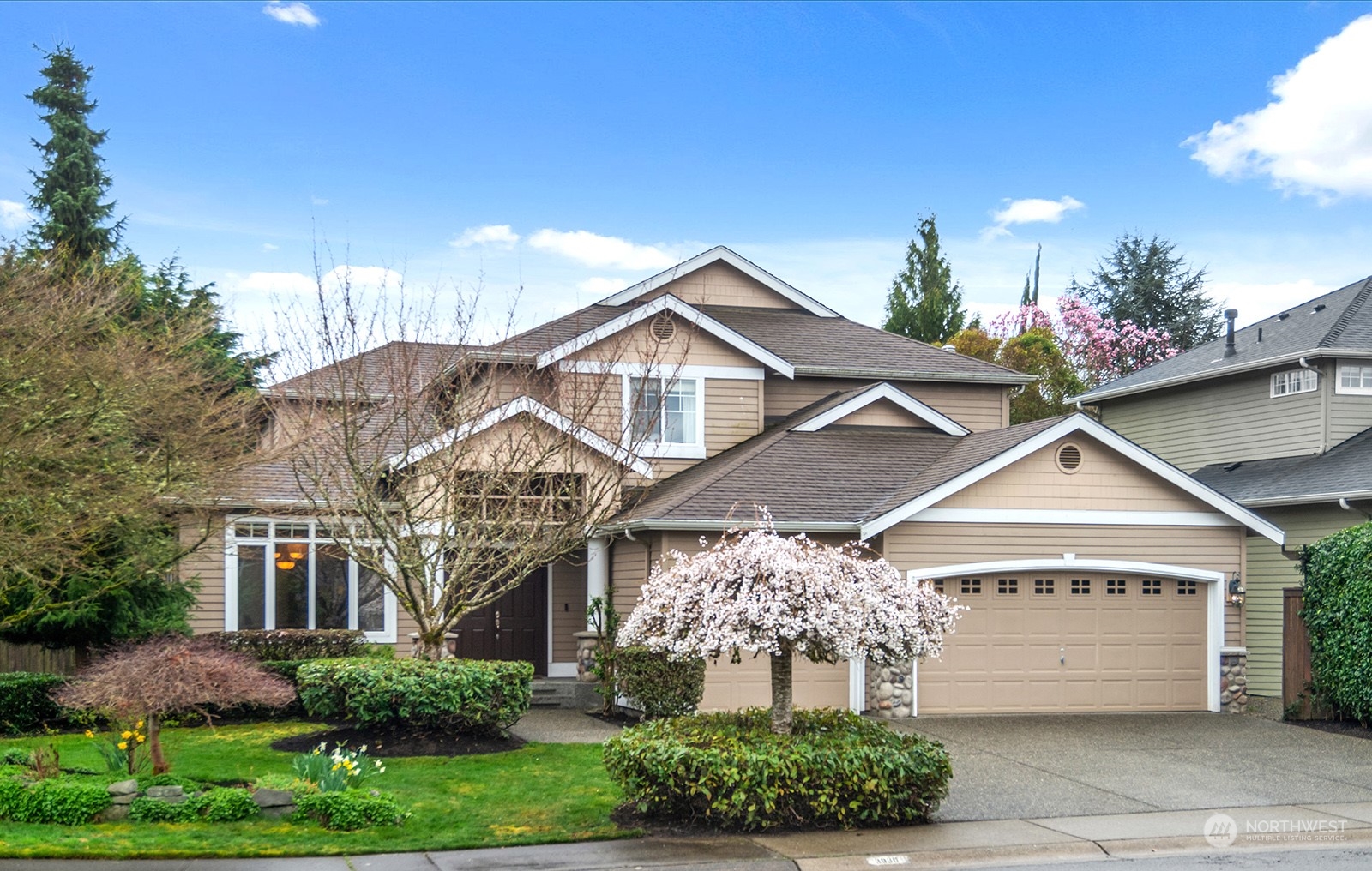 3930 208th Place Southeast Bothell, WA 98021 - Photo 2 of 36 a front view of a house with a yard