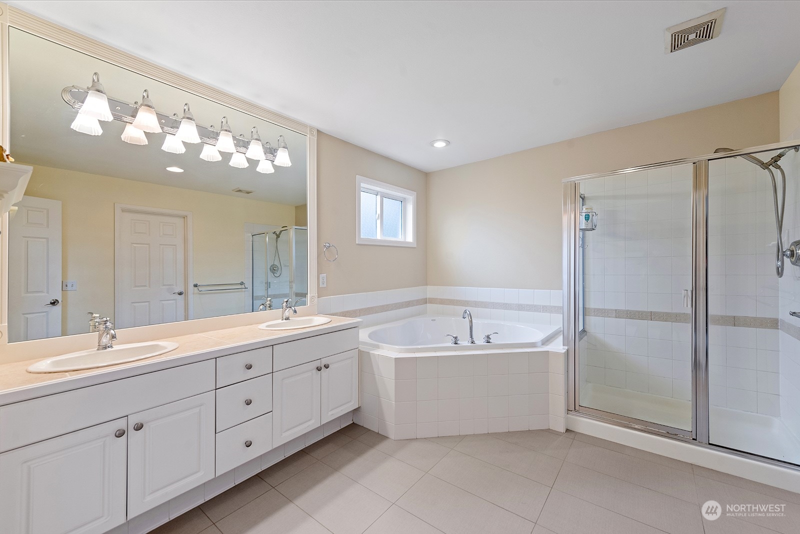 3930 208th Place Southeast Bothell, WA 98021 - Photo 24 of 36 a spacious bathroom with a tub sink and mirror