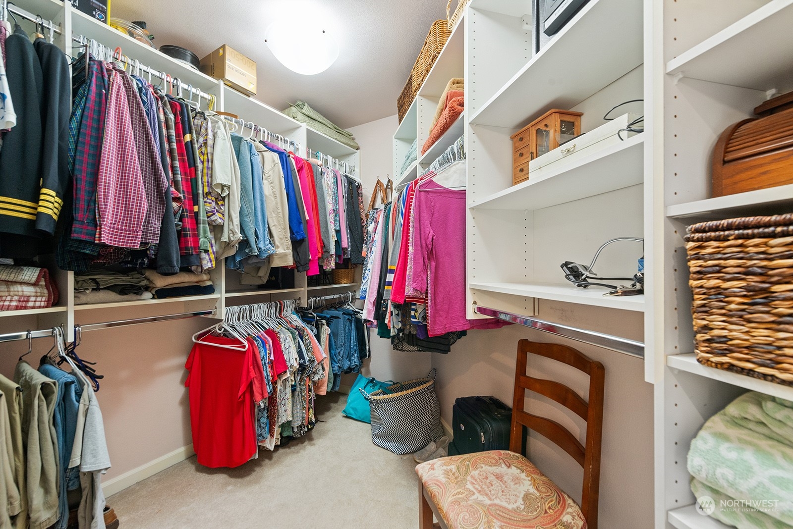 3930 208th Place Southeast Bothell, WA 98021 - Photo 25 of 36 a view of walk in closet with clothes and shoes