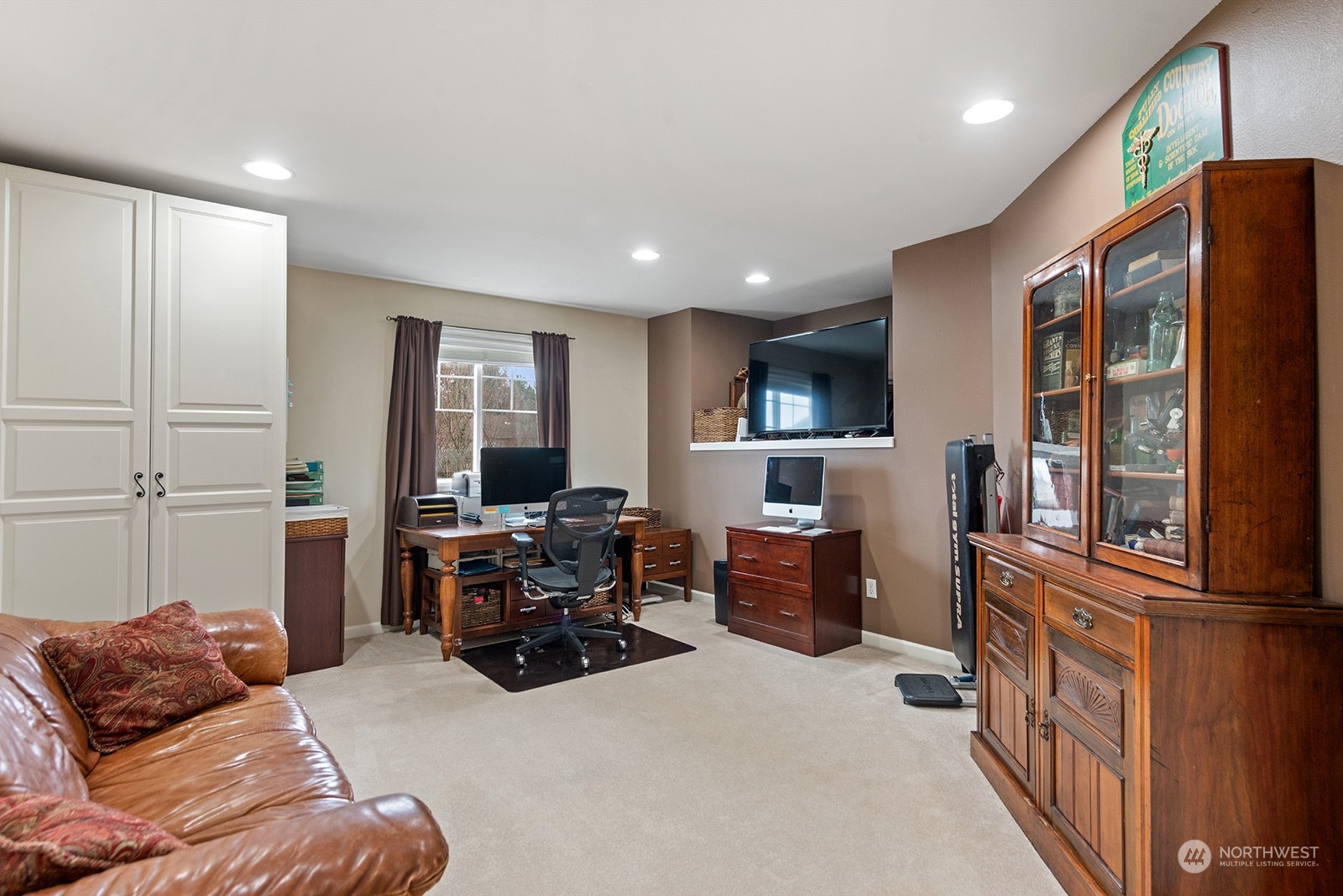 3930 208th Place Southeast Bothell, WA 98021 - Photo 27 of 36 a living room with furniture and a flat screen tv