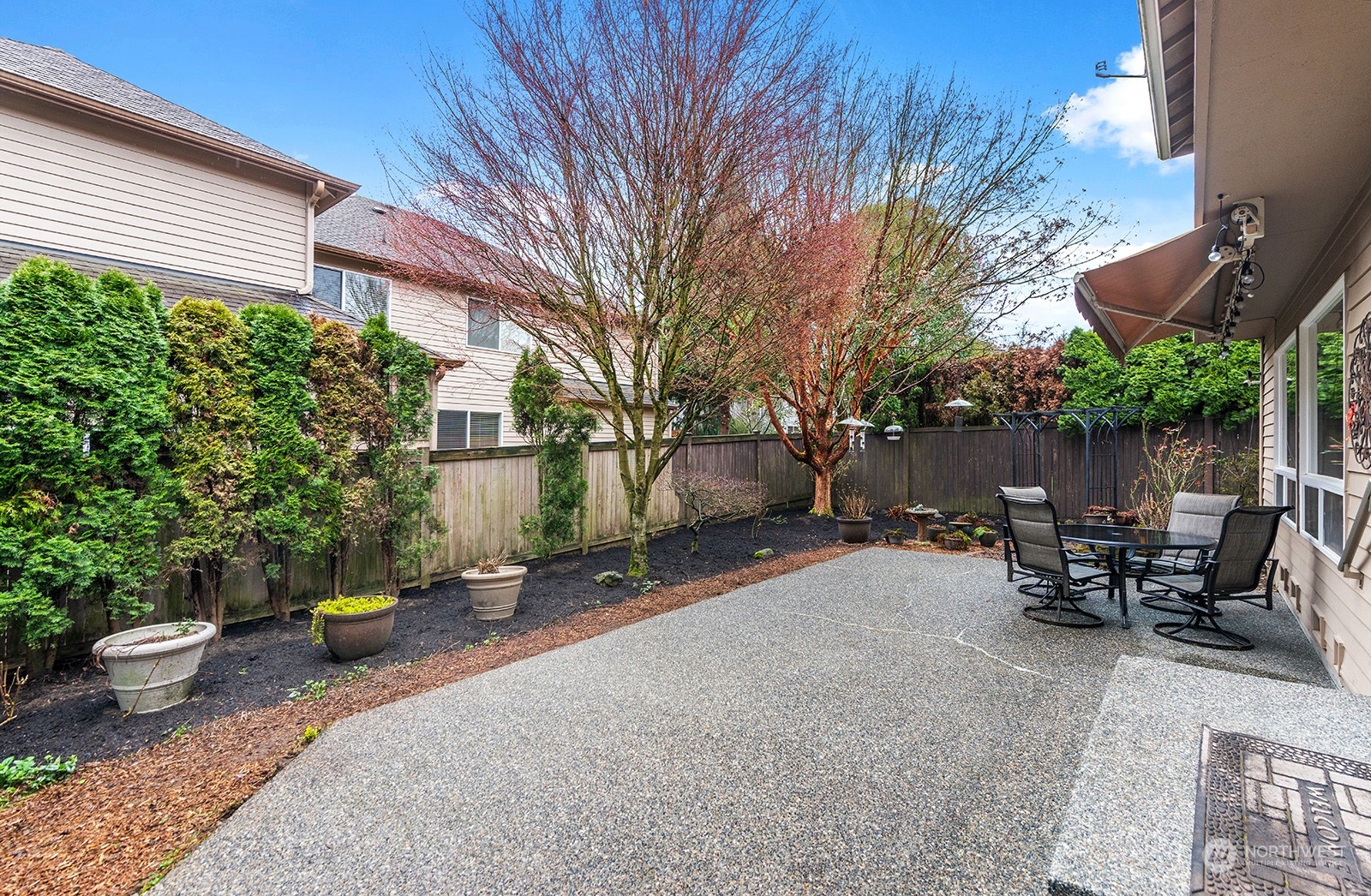 3930 208th Place Southeast Bothell, WA 98021 - Photo 32 of 36 a backyard of a house with table and chairs