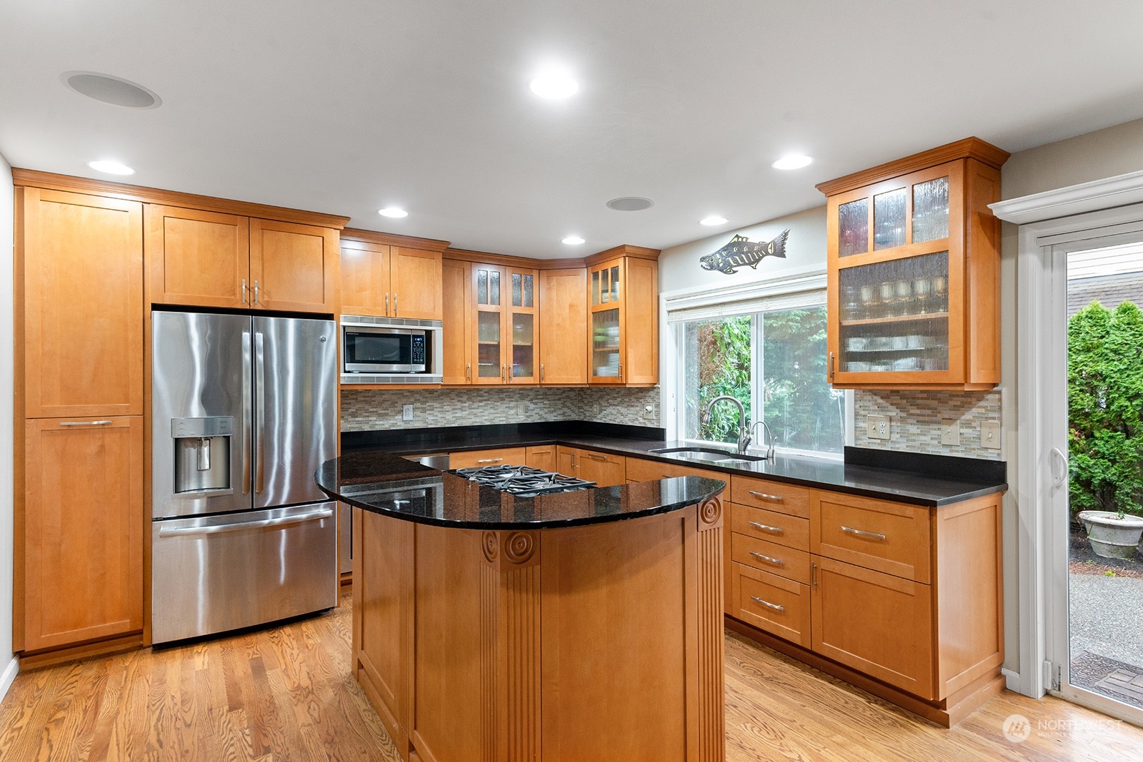 3930 208th Place Southeast Bothell, WA 98021 - Photo 9 of 36 a kitchen with stainless steel appliances granite countertop a refrigerator a sink a stove and a refrigerator