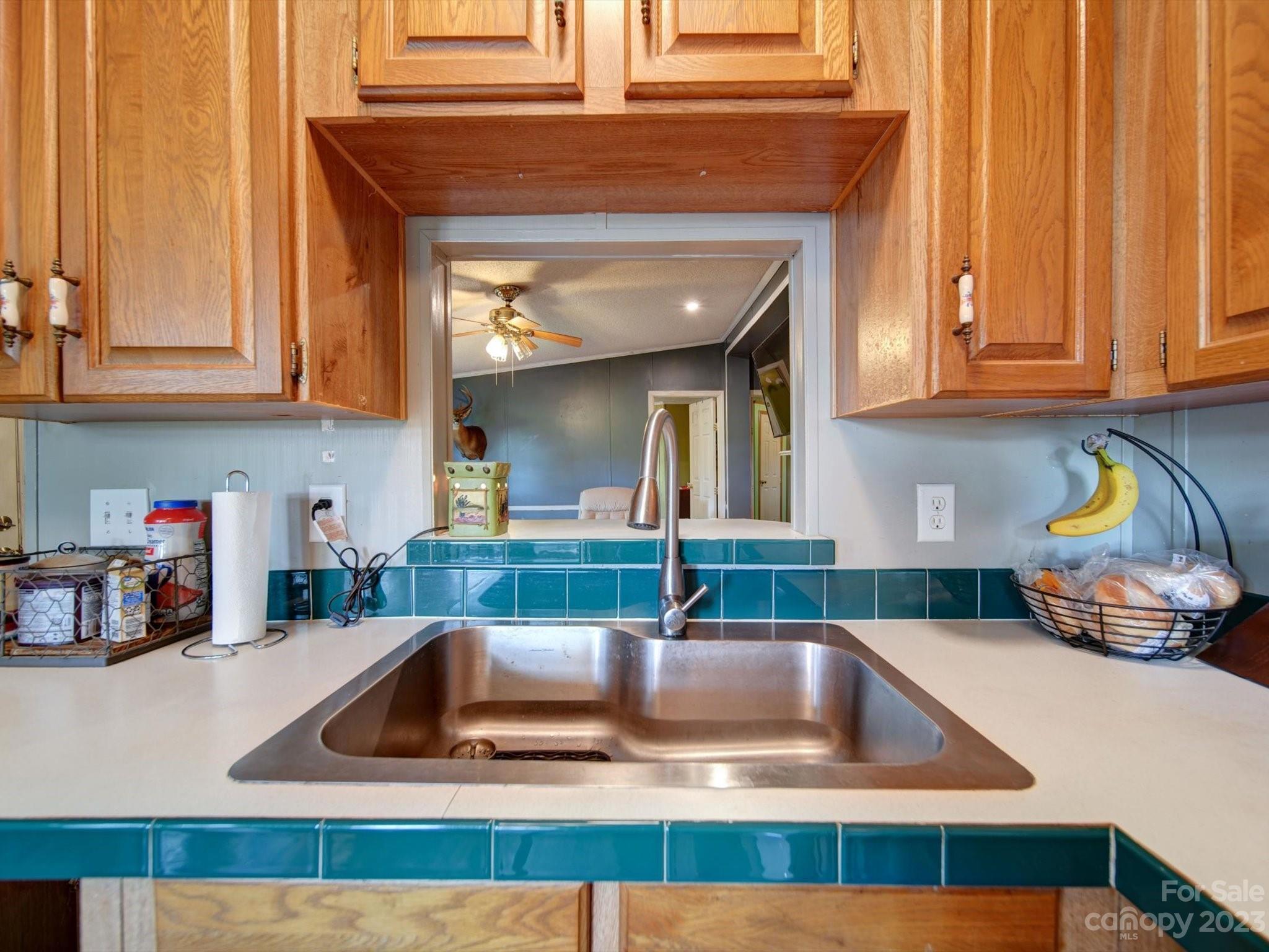 1265 Polk Ford Road Stanfield, NC 28163 - Photo 11 of 40 a kitchen with a sink and a stove top oven