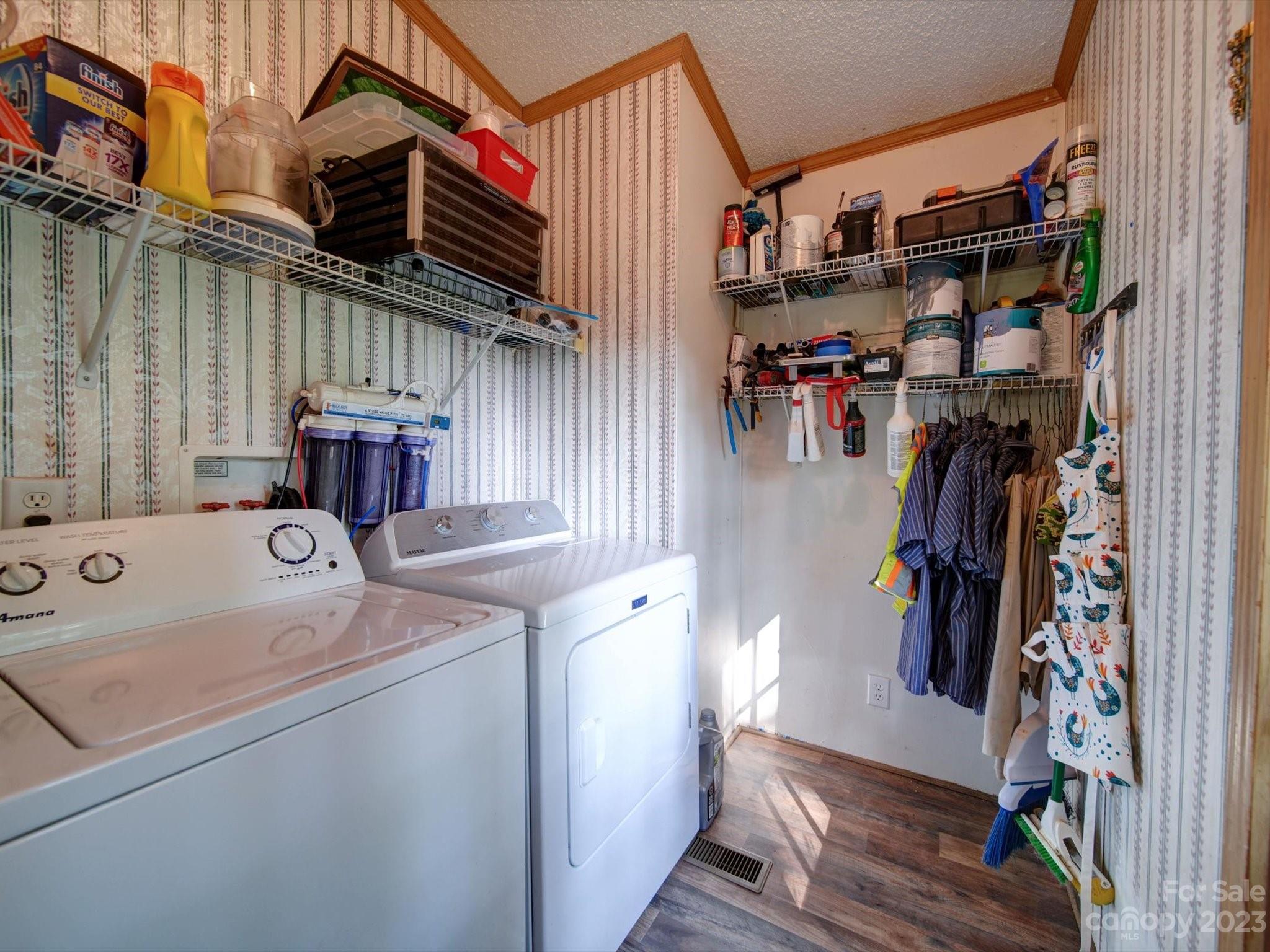 1265 Polk Ford Road Stanfield, NC 28163 - Photo 15 of 40 a view of walk in closet with clothes and shoes