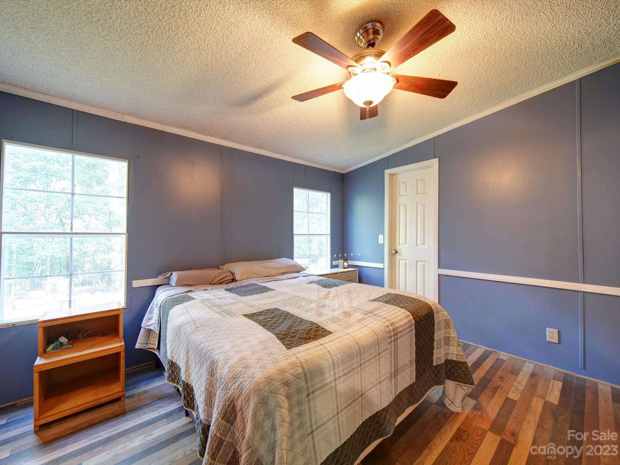 1265 Polk Ford Road Stanfield, NC 28163 - Photo 16 of 40 a bed sitting in a spacious bedroom next to a window