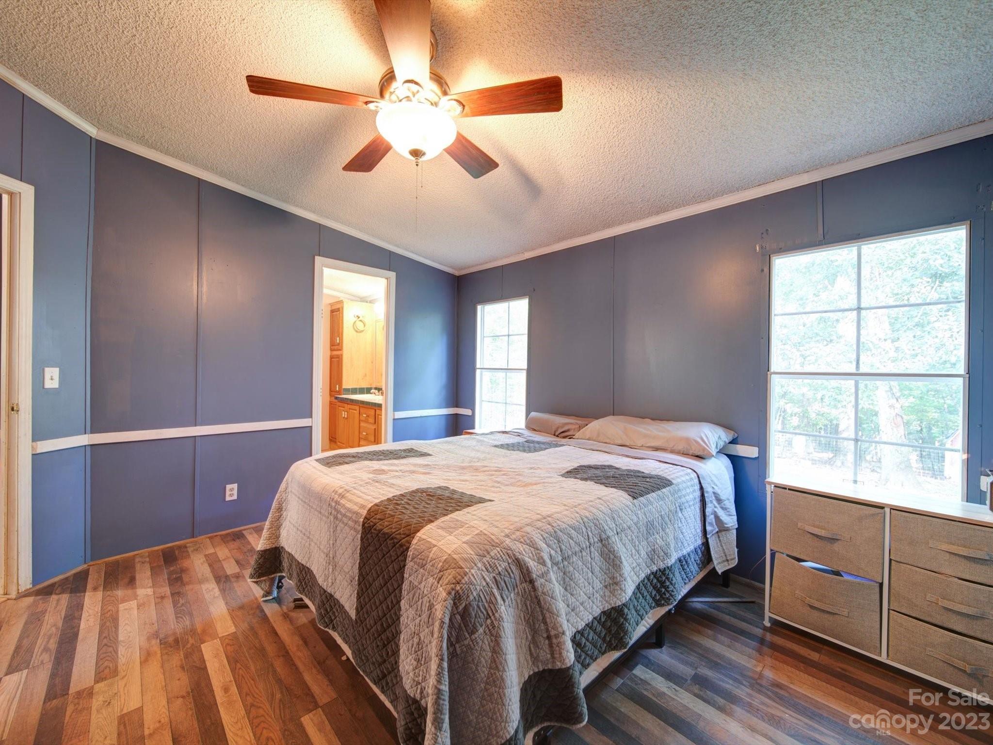 1265 Polk Ford Road Stanfield, NC 28163 - Photo 18 of 40 a bedroom with a large bed and a window