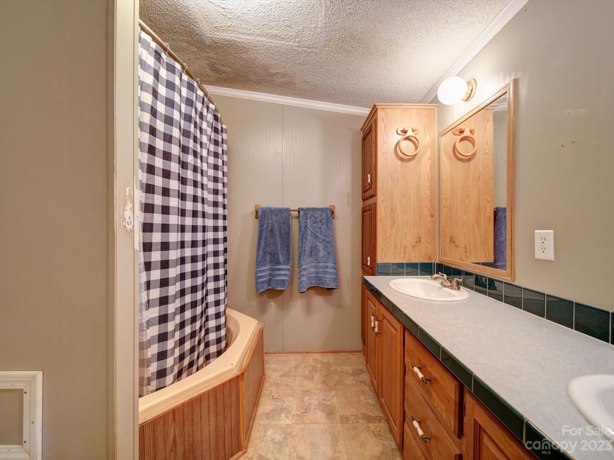 1265 Polk Ford Road Stanfield, NC 28163 - Photo 20 of 40 a bathroom with a sink and a mirror
