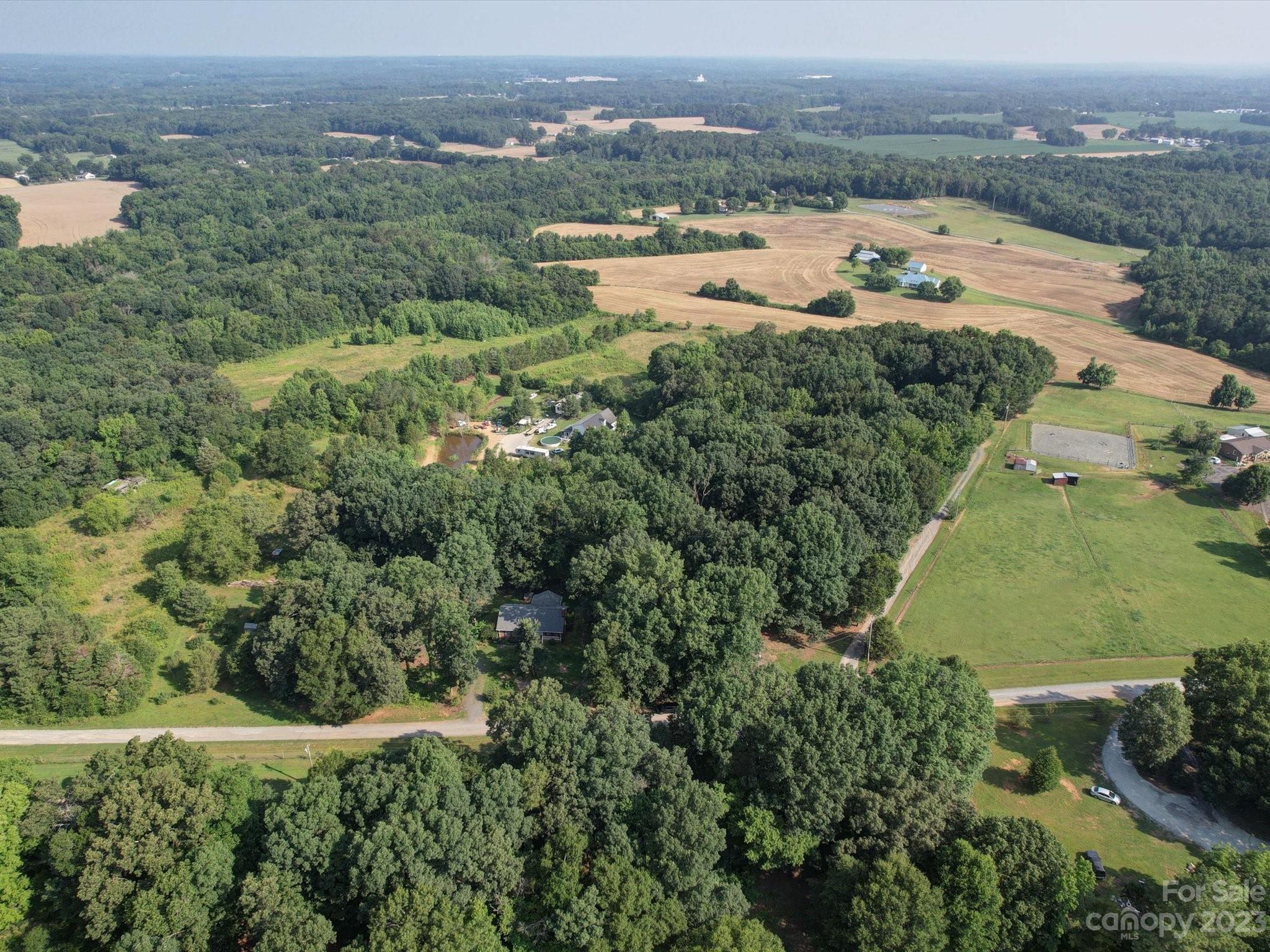 1265 Polk Ford Road Stanfield, NC 28163 - Photo 2 of 40 an aerial view of residential houses with outdoor space and trees