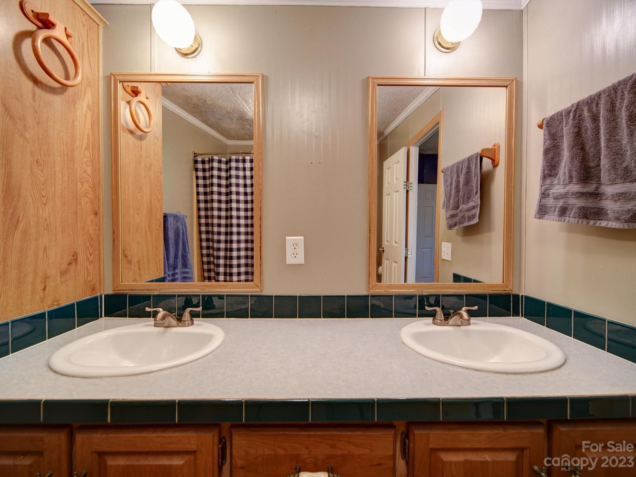 1265 Polk Ford Road Stanfield, NC 28163 - Photo 22 of 40 a bathroom with a sink and a mirror
