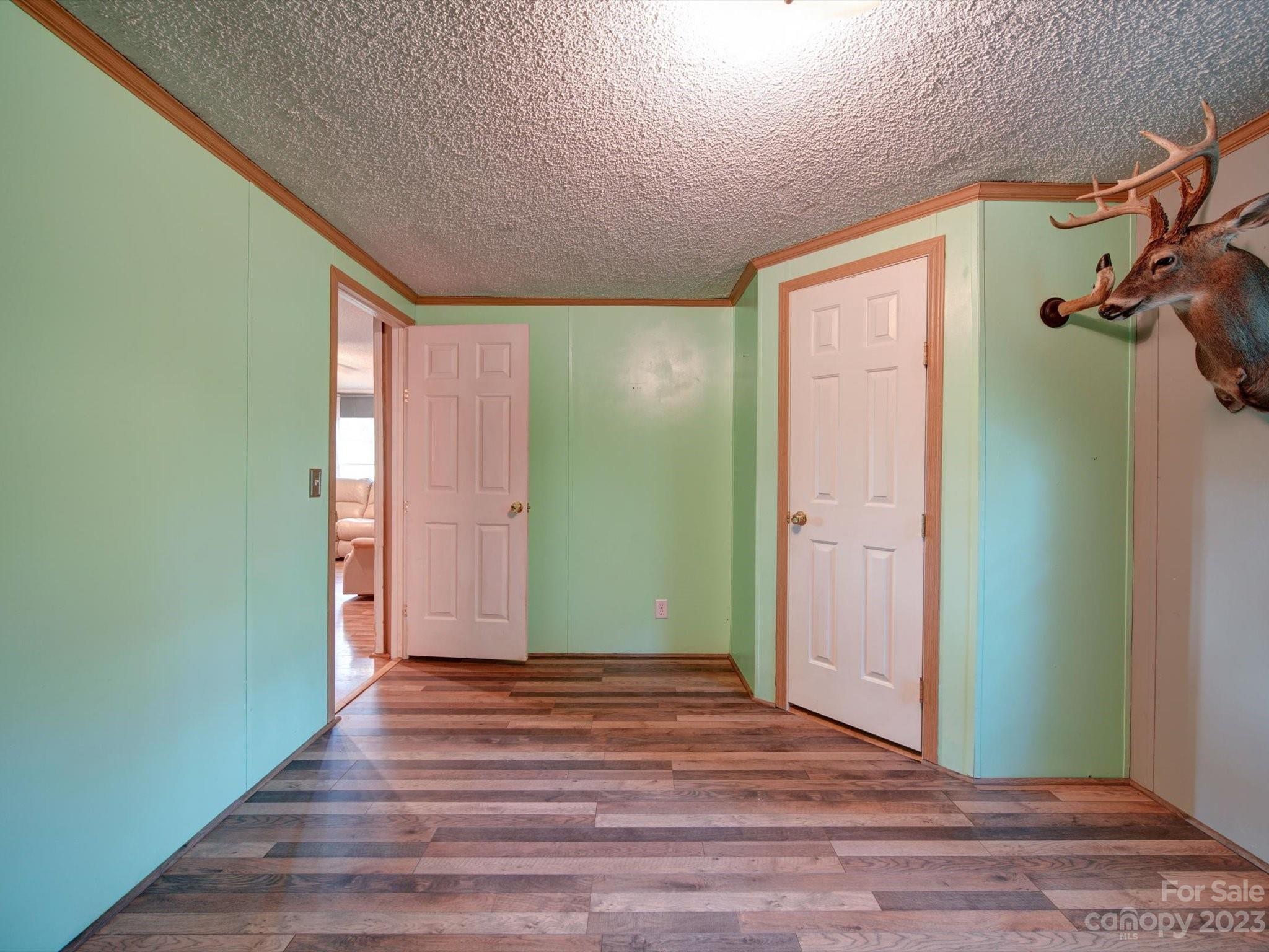 1265 Polk Ford Road Stanfield, NC 28163 - Photo 23 of 40 a view of a room with wooden floor and bathroom