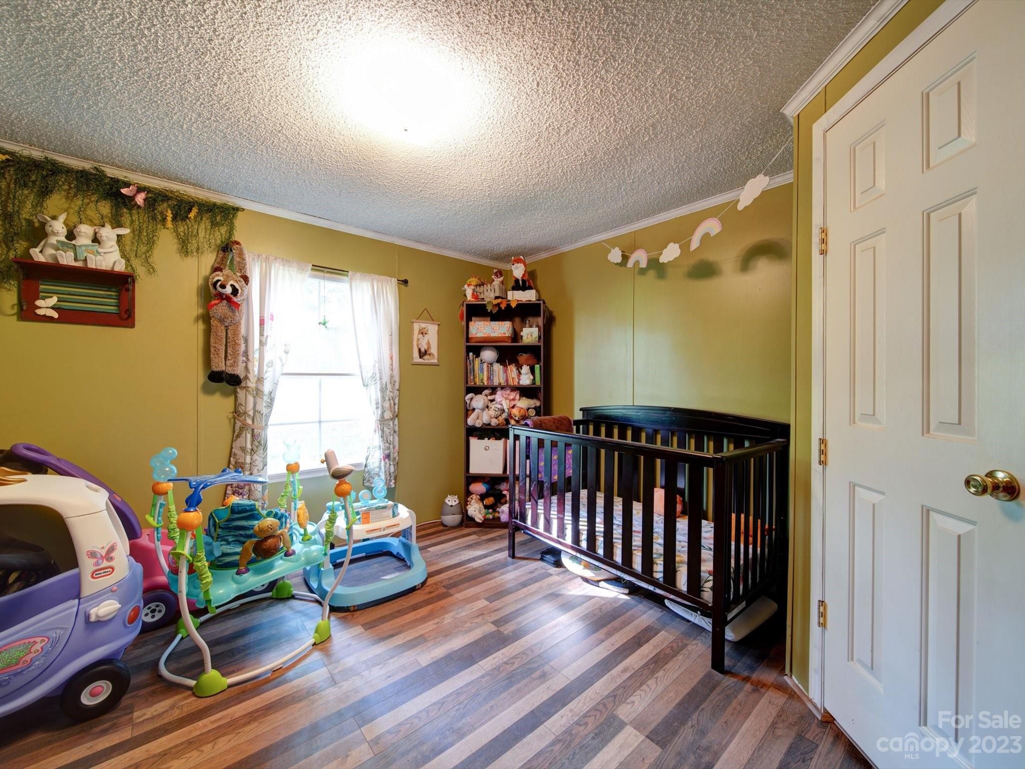 1265 Polk Ford Road Stanfield, NC 28163 - Photo 30 of 40 a bedroom with furniture and a window