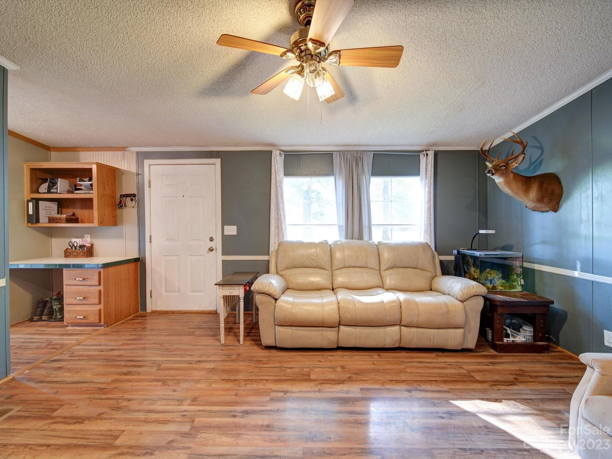 1265 Polk Ford Road Stanfield, NC 28163 - Photo 5 of 40 a living room with furniture and a wooden floor
