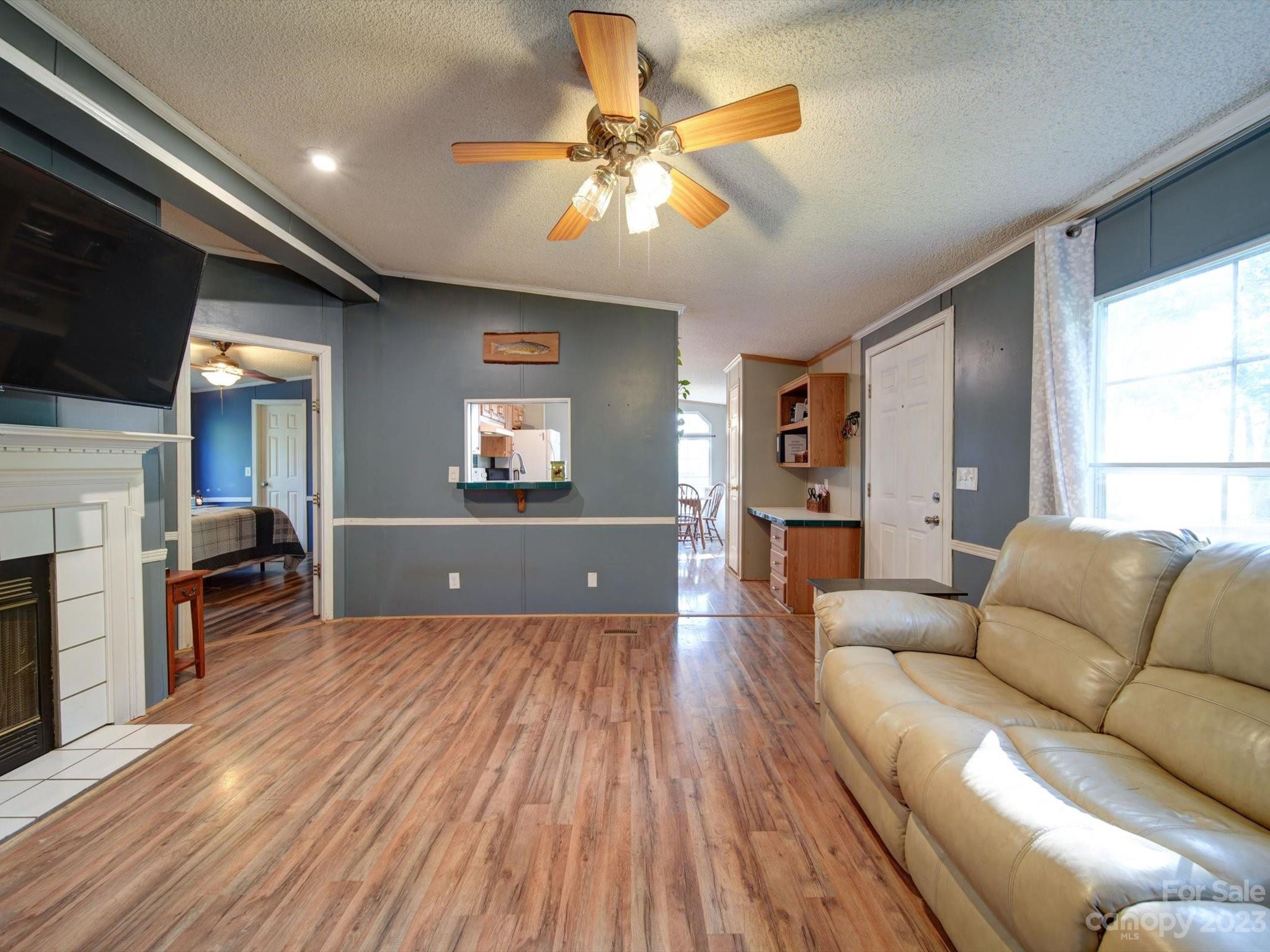 1265 Polk Ford Road Stanfield, NC 28163 - Photo 7 of 40 a living room with furniture and a wooden floor