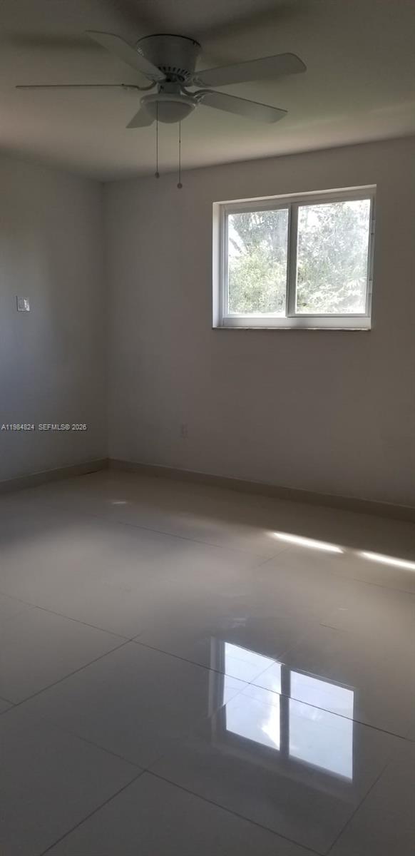 6300 Southwest 21st Street, Unit 1 Miami, FL 33155 - Photo 17 of 33 an empty room with a window