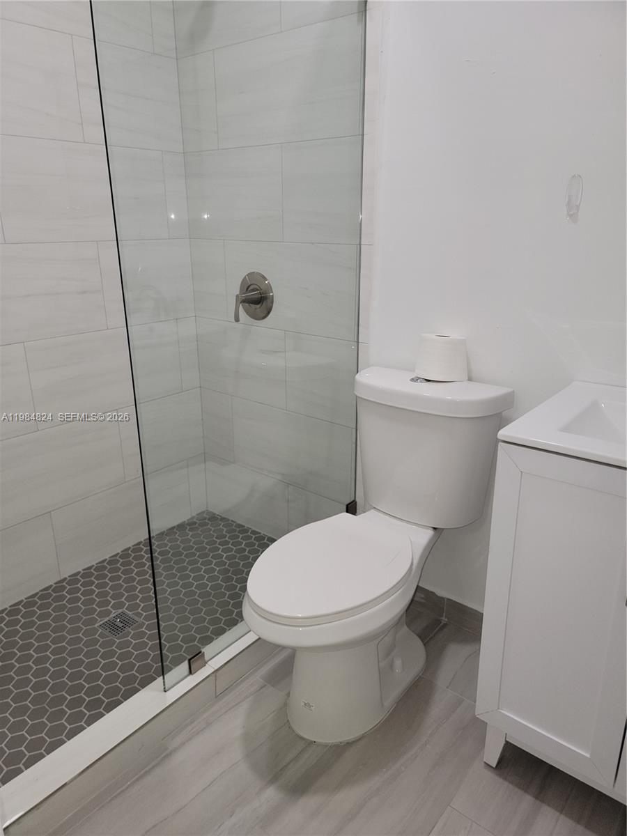 6300 Southwest 21st Street, Unit 1 Miami, FL 33155 - Photo 21 of 33 a white toilet sitting next to a shower