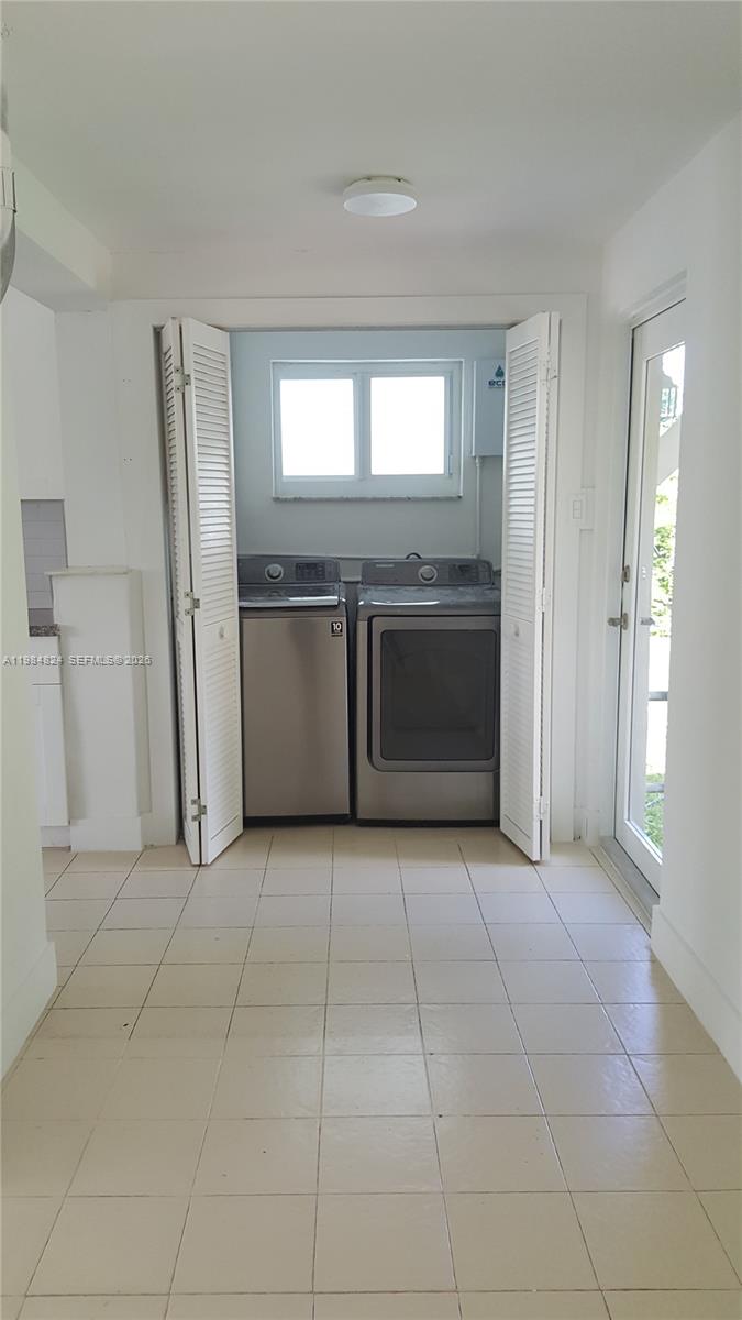 6300 Southwest 21st Street, Unit 1 Miami, FL 33155 - Photo 24 of 33 a view of an empty room with a fireplace and a window