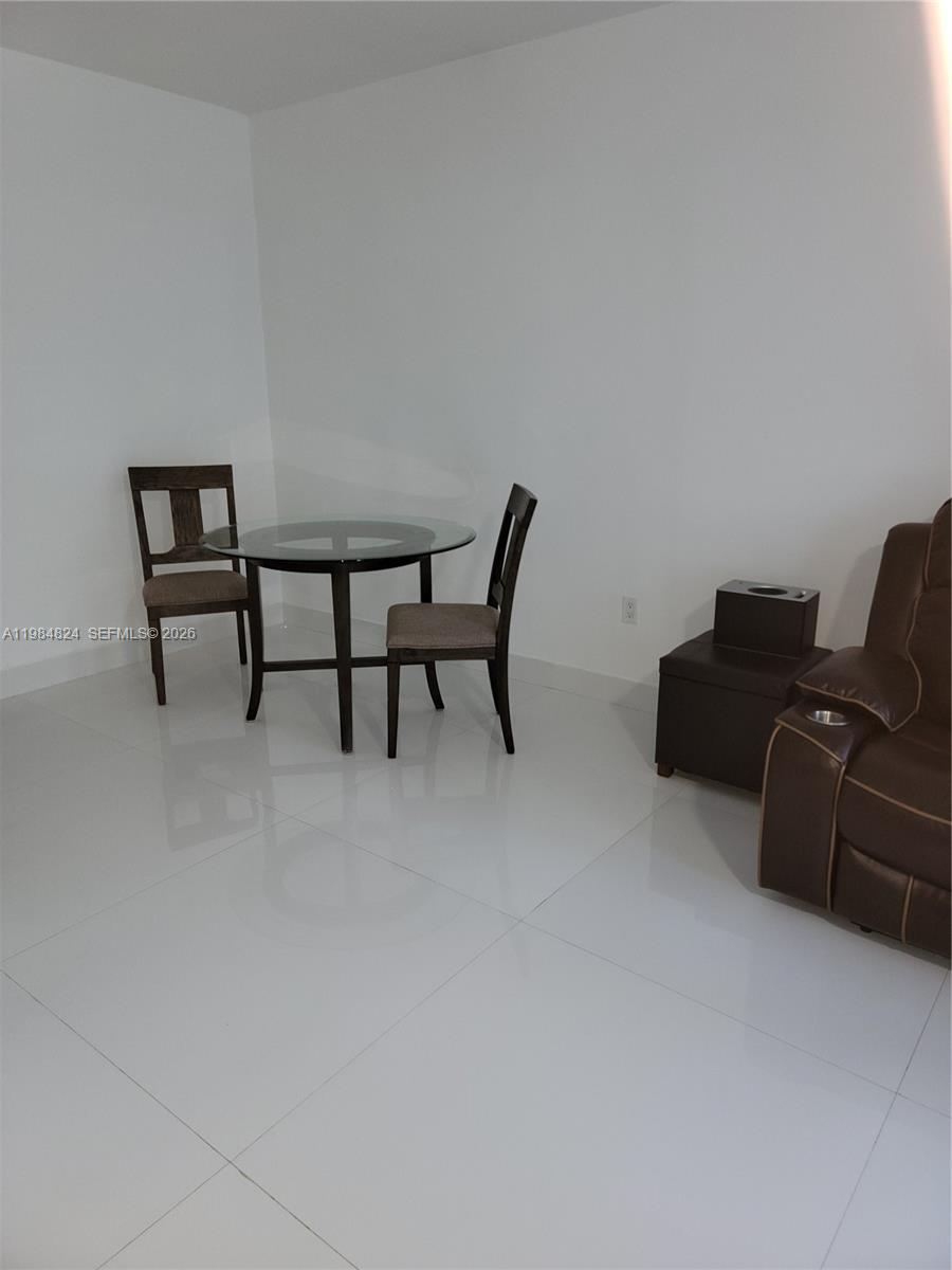 6300 Southwest 21st Street, Unit 1 Miami, FL 33155 - Photo 7 of 33 a livingroom with furniture and a couch