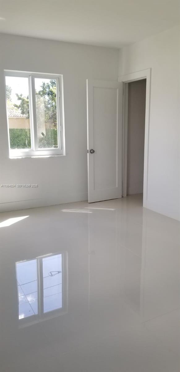 6300 Southwest 21st Street, Unit 1 Miami, FL 33155 - Photo 9 of 33 a view of an empty room with a window