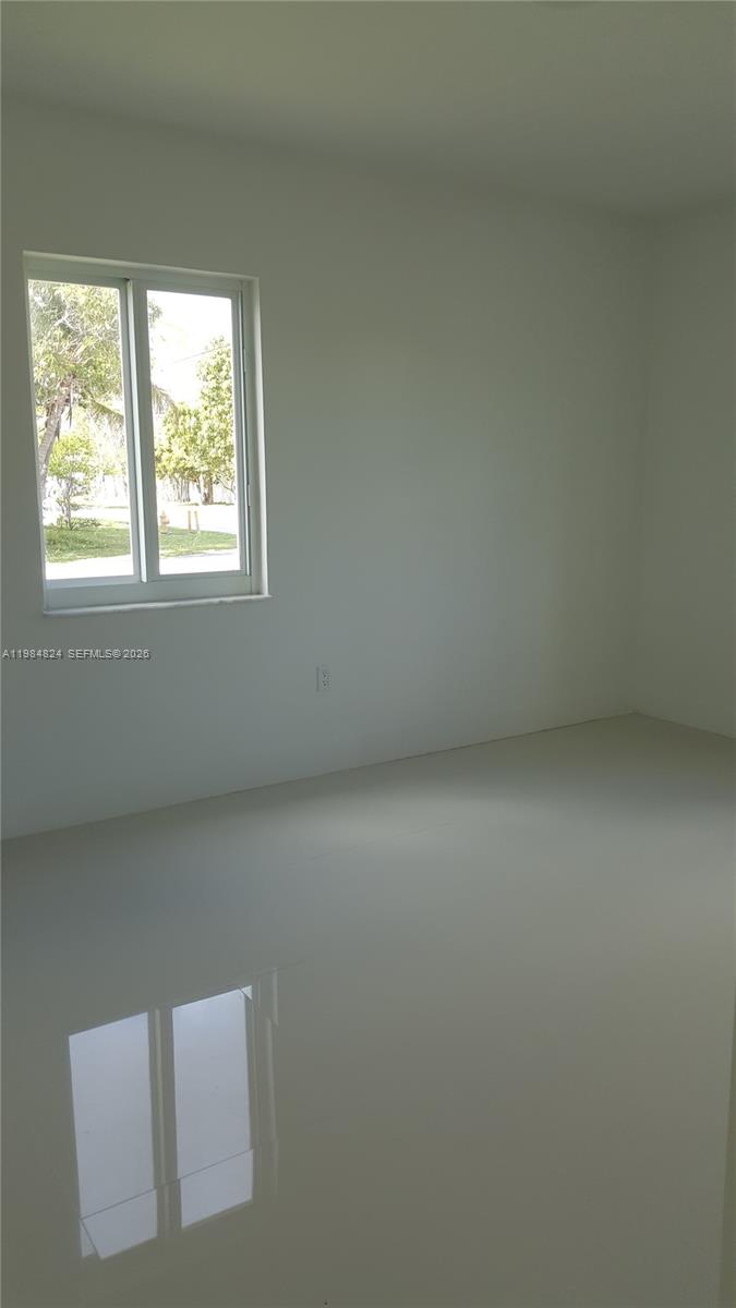 6300 Southwest 21st Street, Unit 1 Miami, FL 33155 - Photo 10 of 33 an empty room with a window