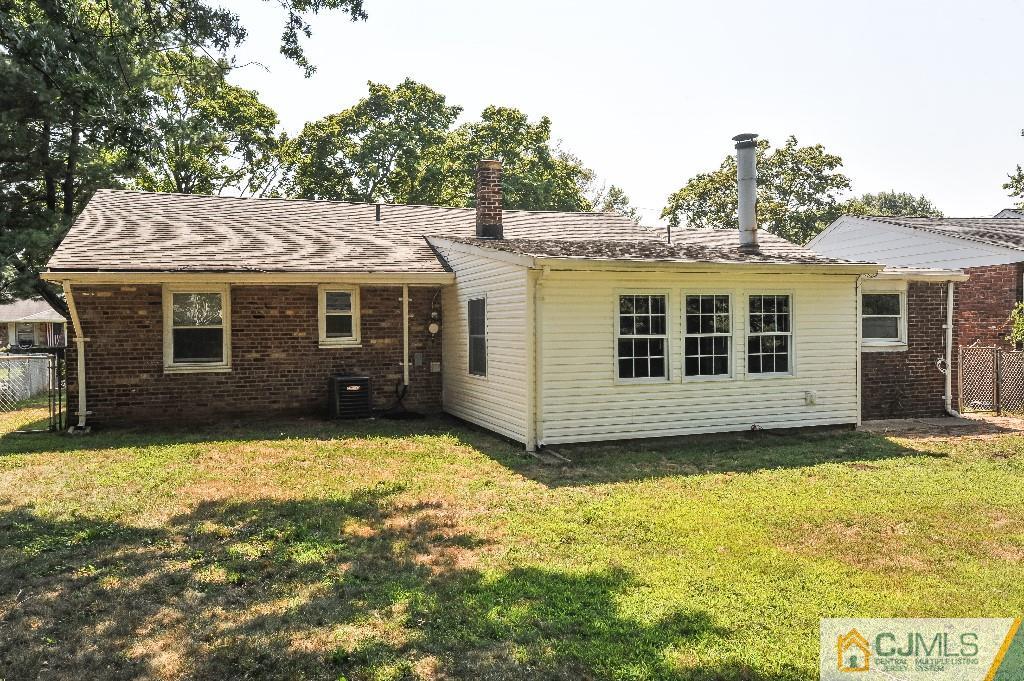 20 Stevens Road Edison, NJ 08817 - Photo 20 of 22 a view of a house with a yard