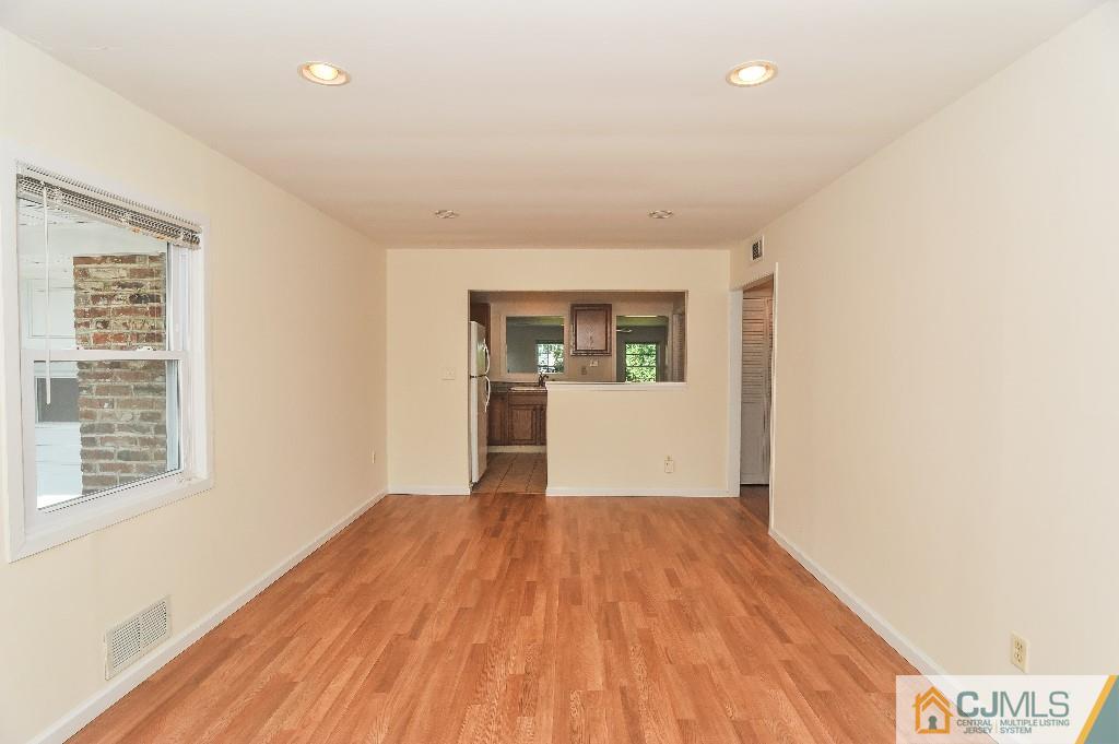 20 Stevens Road Edison, NJ 08817 - Photo 6 of 22 a view of a room with wooden floor and a window