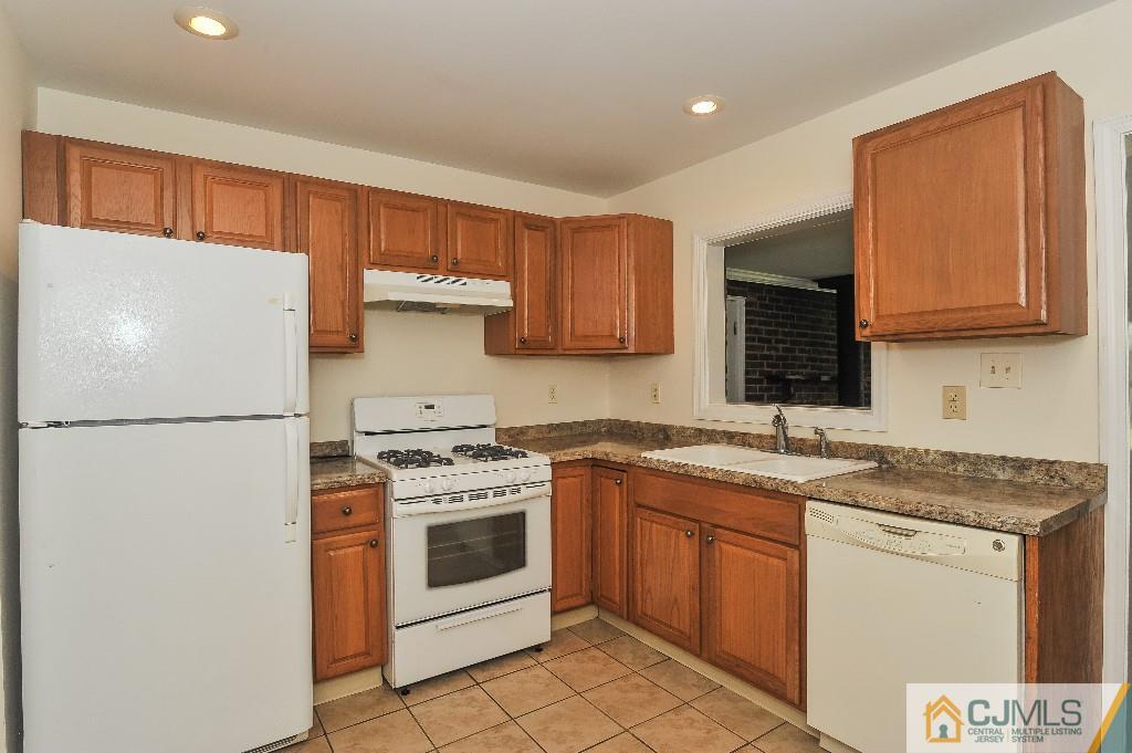 20 Stevens Road Edison, NJ 08817 - Photo 9 of 22 a kitchen with a stove sink and refrigerator