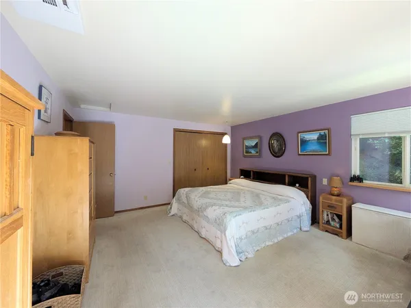a view of a livingroom with furniture and staircase