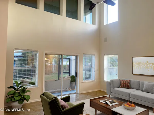 a living room with furniture and a large window