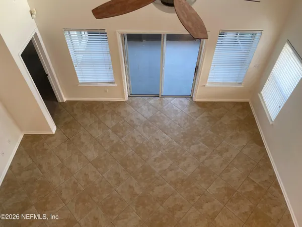 a work room with furniture and a potted plant