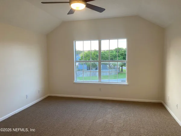 a bathroom with a granite countertop sink a mirror and a bathtub