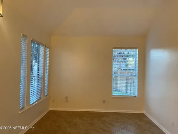 an empty room with windows