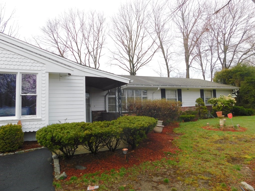 44 Delmar Road Brockton, MA 02302 - Photo 1 of 19 a front view of a house with garden