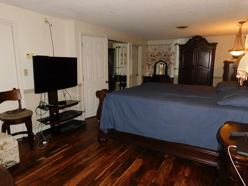 44 Delmar Road Brockton, MA 02302 - Photo 12 of 19 a bedroom with furniture and a flat screen tv